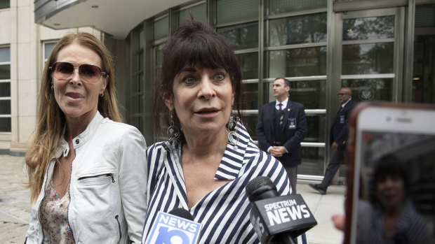 Toni Natalie, center, and Catherine Oxenberg, left, outside Brooklyn federal court after Raniere was found guilty on all counts. Natalie is a former member of NXIVM and Oxenberg's daughter, India, was a member of NXIVM. 