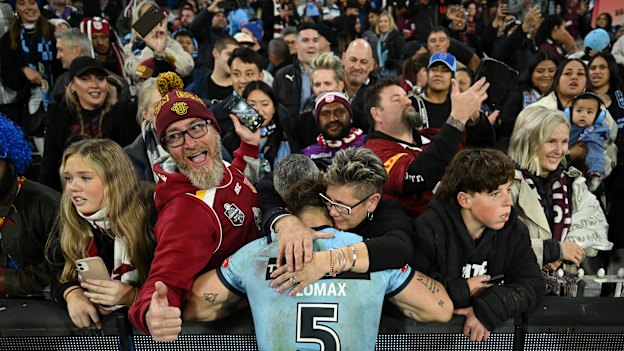 Zac Lomax with his mum after Origin II at the MCG.