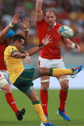 Will Genia gets a kick away against Wales.