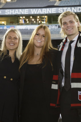 Brooke, Summer and Jackson Warne in front of the newly named Shane Warne Stand at the MCG.