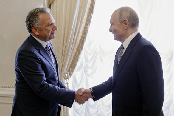 Russian President Vladimir Putin shakes hands with US special envoy Steve Witkoff at Konstantin Palace.