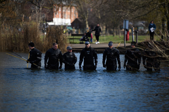Police search teams work their way through Mount Pond on Clapham Common this week. 