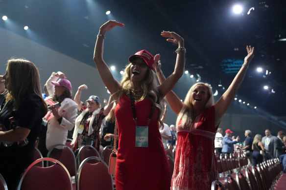 Supporters dance to the song Y.M.C.A. after Republican presidential candidate former President Donald Trump speaks at the Turning Point Believers’ Summit