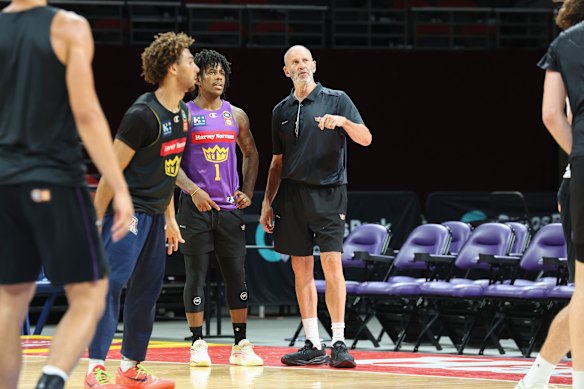 Goorjian talks with star Kings guard Kendric Davis.