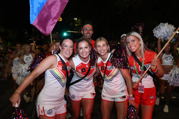 Swans AFLW players Brooke Lochland, Alana Woodward and Maddy Collier walk in the Sydney Gay & Lesbian Mardi Gras Parade.