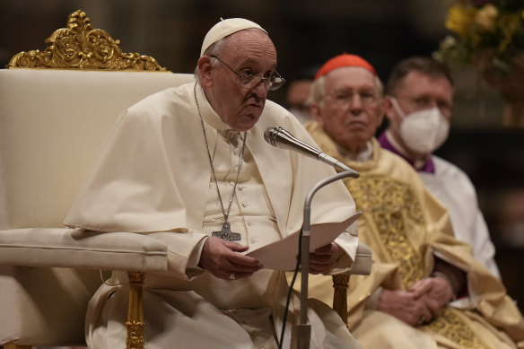 Pope Francis presides over an Easter vigil ceremony at the Vatican.