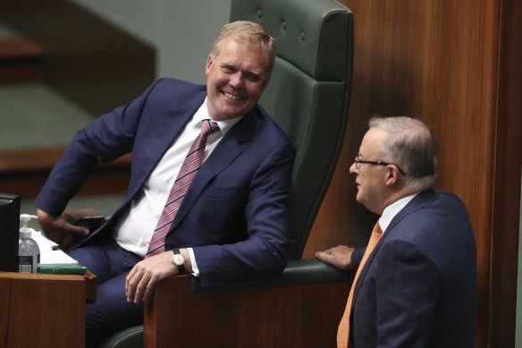 Speaker Tony Smith speaks with Opposition Leader Anthony Albanese during Question Time.