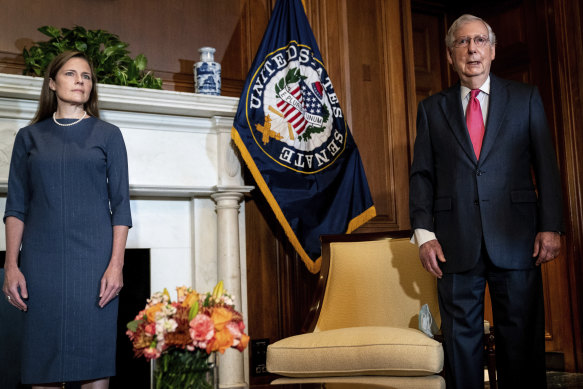 Judge Amy Coney Barrett (left), Trump's nominee to the US Supreme Court, meets with Senate Majority Leader Mitch McConnell.