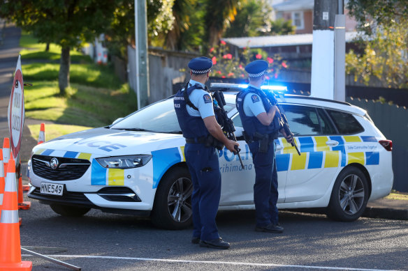 New Zealand Police guard Reynella Drive, Massey, Auckland, after the shooting.