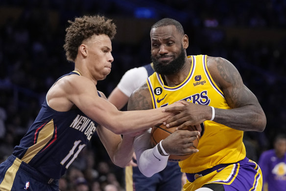 New Orleans guard Dyson Daniels attempts to stop a drive from LA Lakers superstar LeBron James.