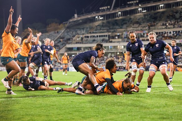 Ashley Marsters of Australia scores one of her two tries.