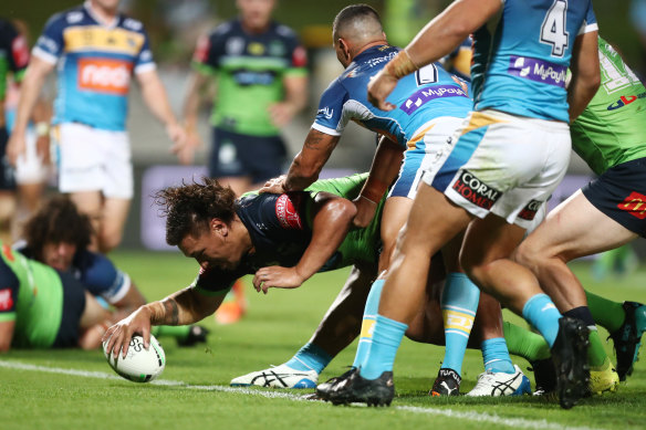 Raiders prop Josh Papalii plants the ball over the stripe against the Titans.
