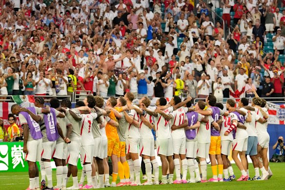 England players sing Wonderwall by Oasis after the match.