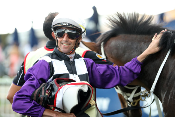 Nash Rawiller gives Osipenko a pat after winning the Hobartville Stakes on February 18.