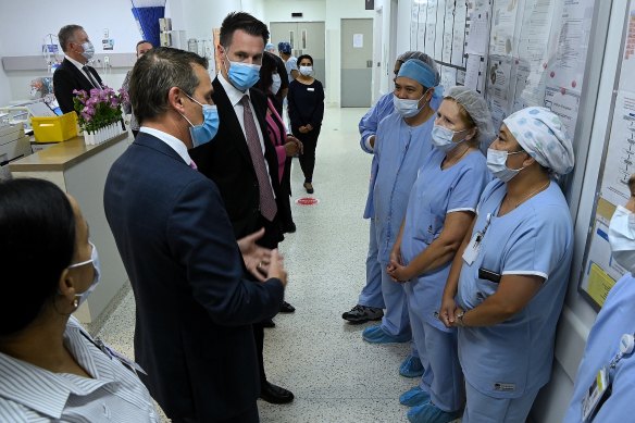 Minns and Park talk with medical staff at Liverpool Hospital.