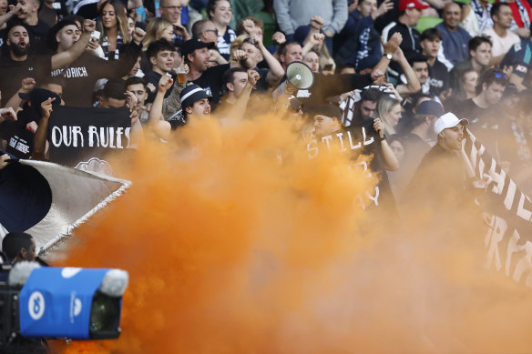 Fans let off flares and smoke bombs at the Melbourne derby match on Saturday.
