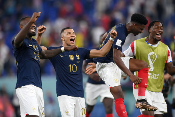 Marcus Thuram and Kylian Mbappe of France celebrate after the teams 2-1 win over Denmark in Doha.