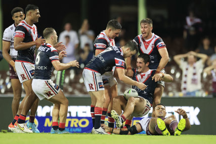 The Roosters celebrate Nat Butcher’s second-half try.