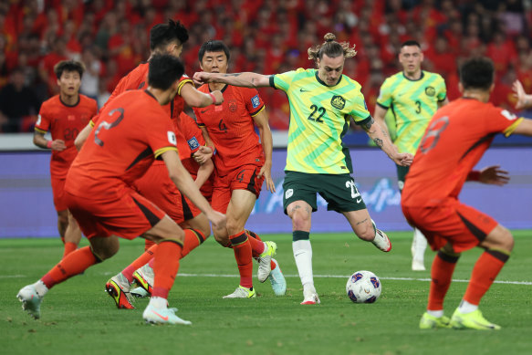 Jackson Irvine scores Australia’s first goal during their match against China in Hangzhou.