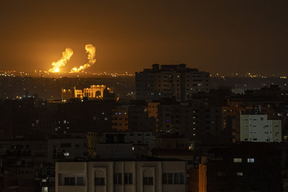 Fire and smoke rise following an Israeli airstrike in southern Gaza Strip in the early hours of Friday.