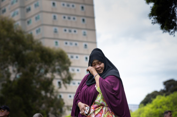 Public housing resident Aisha Abdi addresses the rally on Saturday.