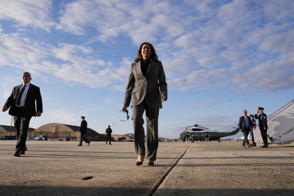 Democratic presidential nominee Vice President Kamala Harris walks over to speak to members of the media upon her arrival at Andrews Air Force Base on Sunday.