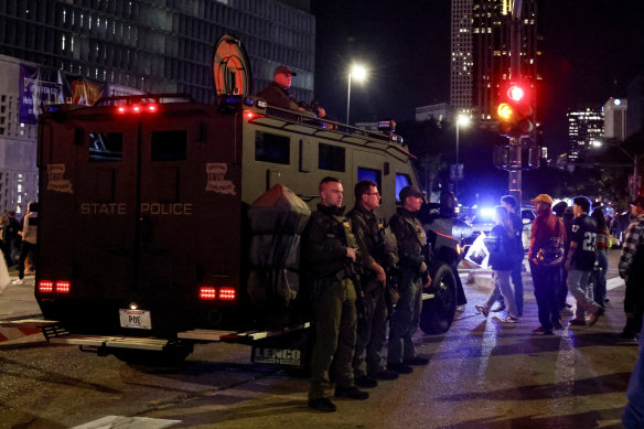 Fans leave the Caesars Superdome with a large presence of security after the Sugar Bowl college football game.