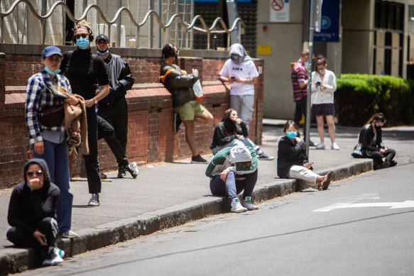 People queue for a COVID-19 test at St Vincent’s Hospital in Fitzroy on Monday.