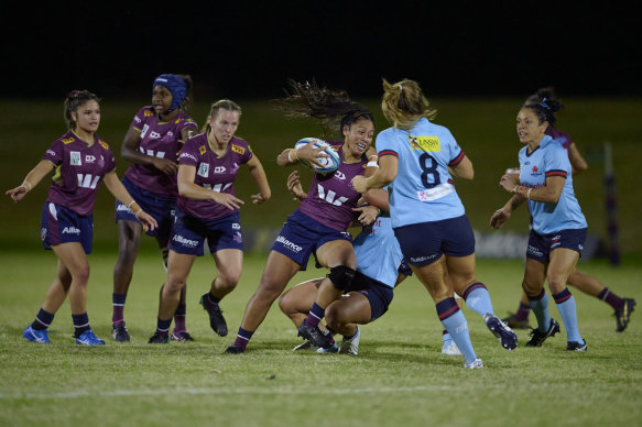 The Reds’ Cecilia Smith hits the line during a Super W semi-final against the NSW Waratahs in 2022. 