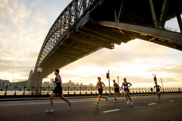 Runners passing under the Sydney Harbour Bridge.