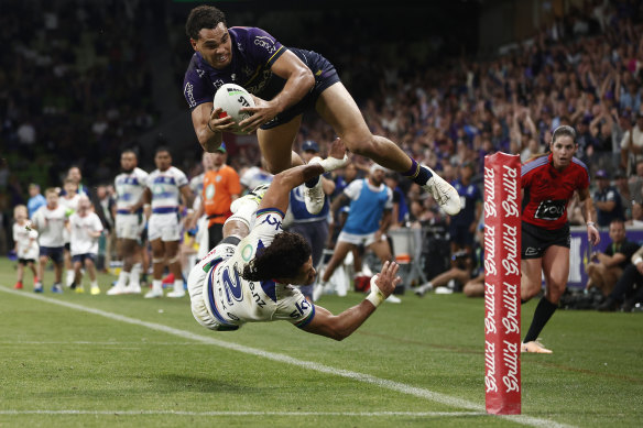 Xavier Coates of the Storm scores the match-winning try.