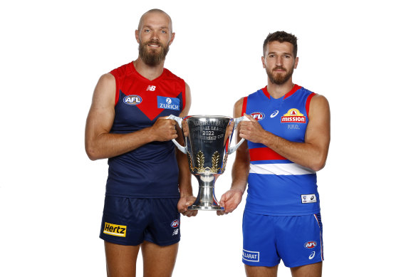 Melbourne skipper Max Gawn and Dogs captain Marcus Bontempelli with the premiership cup.
