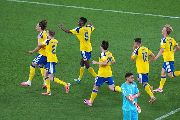 Sweden celebrate their fourth goal. 