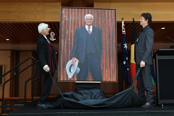 Bob Katter admires the portrait as artist David Darcy looks on.