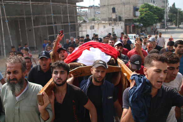 Family and friends mourn a Palestinian man in Gaza City on Sunday.
