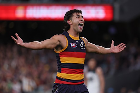 Josh Rachele of the Crows celebrates a goal.