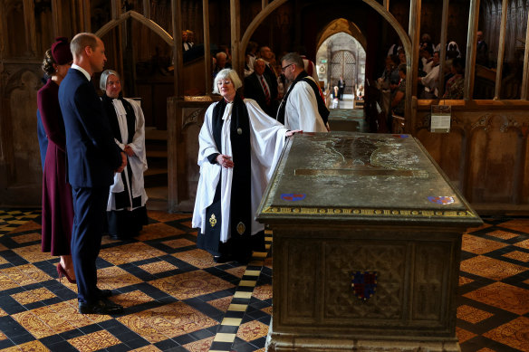 Prince William and wife Catherine with Sarah Rowland Jones, the Dean of St Davids Cathedral, next to the Tomb of Edward Tudor as they visit the cathedral on the anniversary of the Queen’s death.