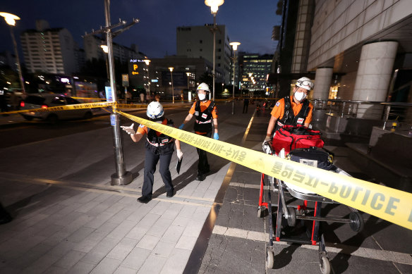 Rescue workers are seen at the scene of the incident in Seoul.