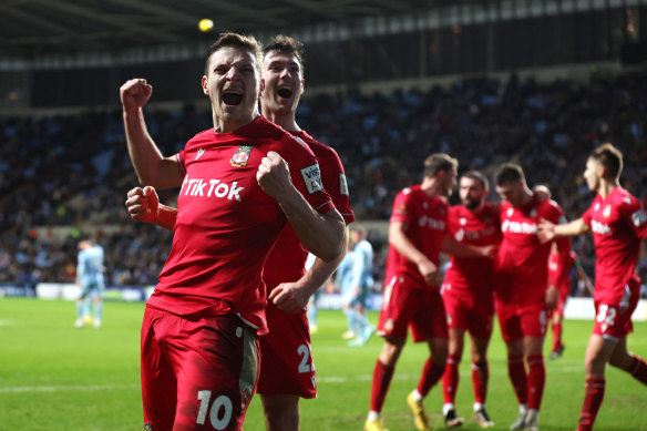 Wrexham’s Paul Mullin celebrates in Coventry.