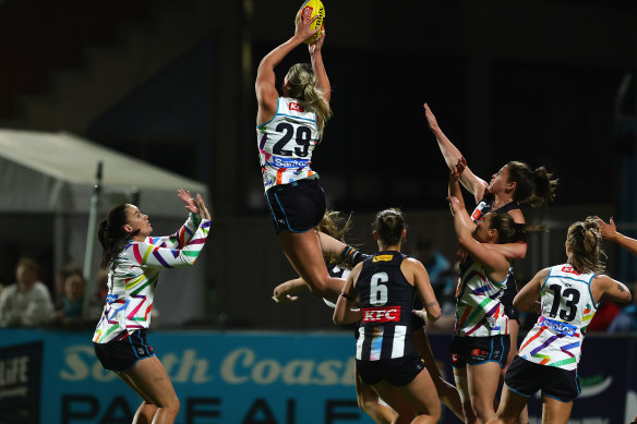 Flying high: Matilda Scholz of Port Adelaide takes a spectacular mark.