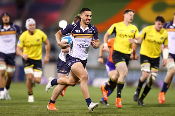 Tom Wright heads to the try line in the Brumbies’ win over the Hurricanes.