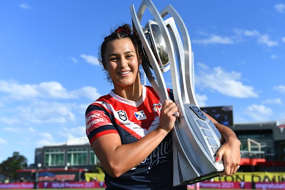 Roosters captain Corban Baxter poses with the Premiership trophy after her team’s victory over the Dragons in the NRLW grand final.