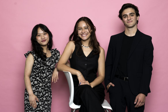 Kiana Levy (centre) with fellow first in course recipients Angie Wang and Orlando Douglas-Giles yesterday.