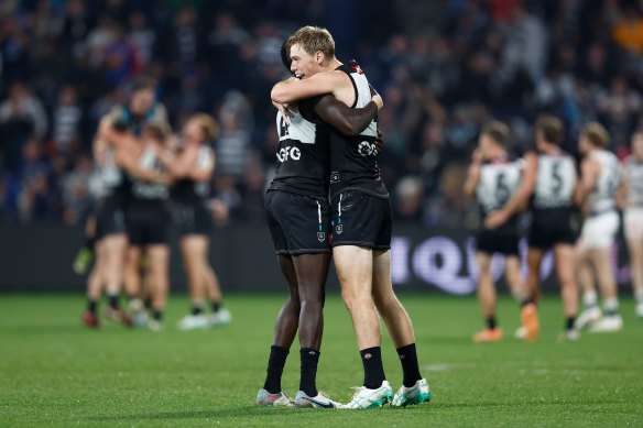 Aliir Aliir (left) and Todd Marshall of the Power celebrate at the final siren.
