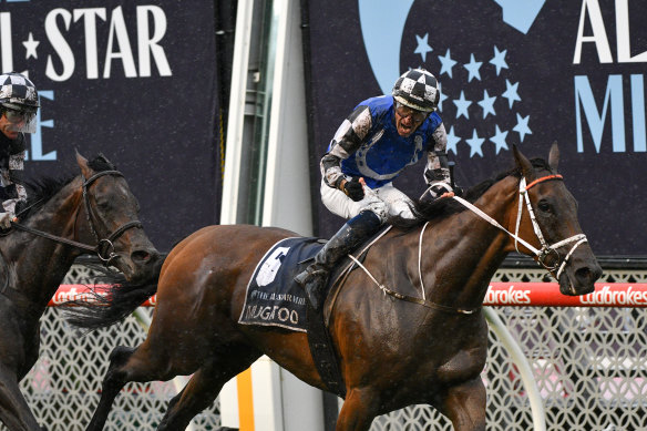 Hugh Bowman celebrates after steering Mugatoo to victory over Russian Camelot in the All-Star Mile at Moonee Valley.