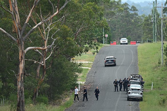 Detectives and tactical officers establish a crime scene in Glenorie.