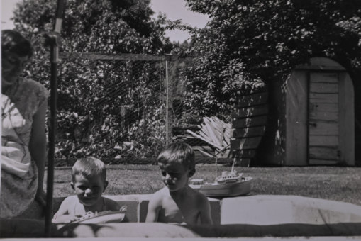 Madeline Binns, left and sons Geoffrey, centre, and Rodney, right, circa 1962 with air raid shelter at right.
