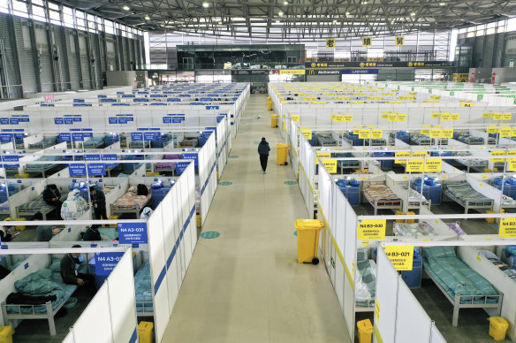 People with mild and asymptomatic cases of COVID-19 quarantine at the Shanghai New International Expo Centre on Friday.