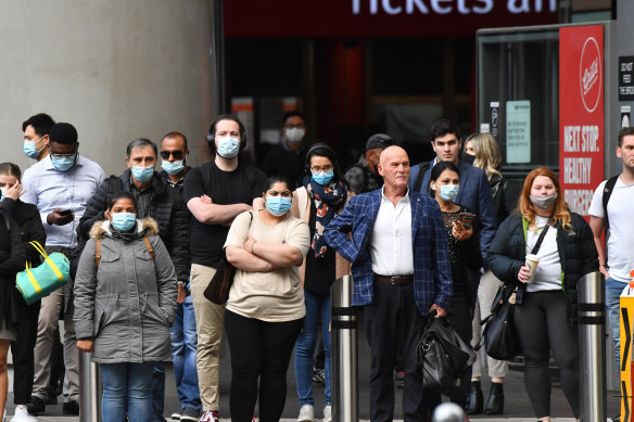 Workers returning to their office buildings earlier this month.