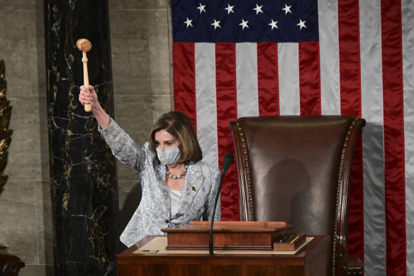Democrat Nancy Pelosi waves the Speaker's gavel during the first session of the 117th Congress in the House Chamber in Washington on Sunday, January 3.